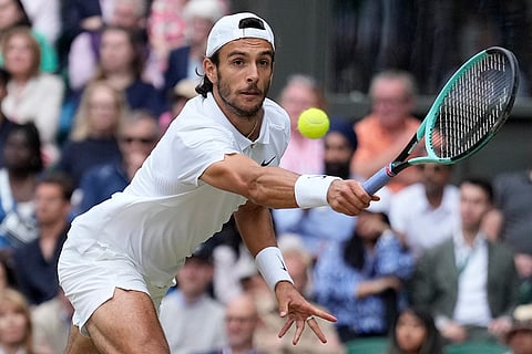 Lorenzo Musetti return the ball to Novak Djokovic